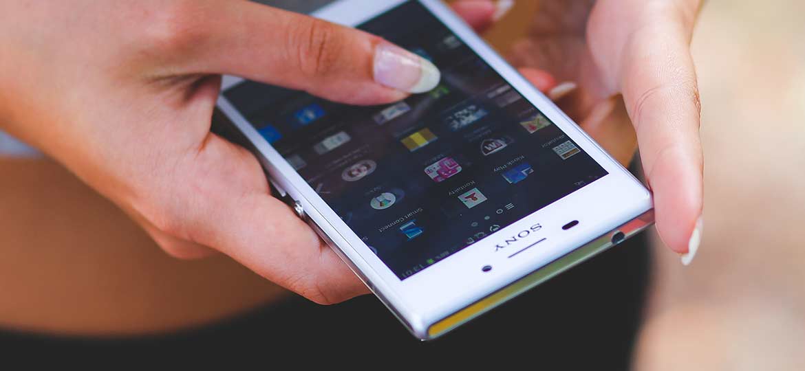 Person Holding a Smartphone Person Holding a Smartphone